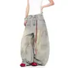 Jeans de pierna ancha sueltos hasta el suelo, estilo hip-hop de alta calle retro americano, desgastados y teñidos, 2026