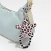 Nuevo Estilo Miu Dulce y Fresco Alto Valor Cristal Imitación Perlas Cuero Estampado Leopardo Estrella Mariposa Llavero DIY