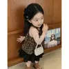 Ropa Infantil Estilo Coreano 2026 Verano Nuevo Conjunto para Niñas Chaleco Elegante con Estampado de Leopardo Falda Negra de Pastel para Niños Conjunto de Dos Piezas