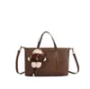 Bolso de mano grande informal retro para mujer transfronterizo, nuevo estilo 2026, versátil bolso de hombro y bolso cruzado para ir al trabajo, bolso tote para mujer