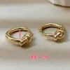 Pendientes Exquisitos de Corazón Nudo Pequeño Luochen Simples Elegantes Moda Nicho Versátiles Hebillas de Oreja para Mujer