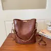 Bolso retro pequeño de alta calidad transfronterizo para mujer 2026 Otoño/Invierno nuevo bolso cruzado popular bolso de cubo elegante de nicho