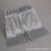 Pantalones de pijama finos de seda para hombre, verano, seda, holgados, casuales, talla grande, pantalones para casa, color liso, shorts de seda helada