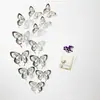 Pegatinas de pared autoadhesivas 3D tridimensionales de mariposa hueca de corte de papel de diez colores, pegatinas de decoración para pared de fondo DIY para el hogar LK07