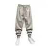 Nuevos pantalones deportivos casuales de otoño e invierno para hombre, de corte holgado, modernos, elegantes, sencillos, versátiles y adecuados para estudiantes, con un diseño de pierna cónica