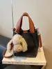 Bolsa Saco com Padrão Lichia para Mulheres 2026 Inverno Nova Casual Versátil Bolsa de Mão Bolsa de Ombro Fashionável para o Dia a Dia Bolsa Transversal