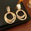 Pendientes de Plata y Oro Geométricos Transfronterizos Europeos y Americanos, Pendientes de Botón Minimalistas de Moda y Únicos, Pendientes Exagerados de Nicho con un Toque de Alta Gama