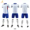 Suministro directo de fábrica en stock set de equipación de fútbol camiseta de partido de club venta al por mayor secado rápido manga corta traje de entrenamiento para reunión deportiva escolar