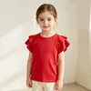 Camiseta de manga corta de color liso para niña, nueva de verano, personalizada para comercio transfronterizo, top con volantes de cuello redondo estilo coreano, camisa versátil de manga corta