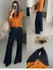 TOP de Otoño estilo Europeo Mercado de los Trece de Guangzhou producto principal: Jeans acampanados versátiles de corte slim con doble bolsillo y cinturón 3135