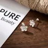 Pendientes de flor de cerezo de plata pura S999 para mujer, lujo ligero y sensación de alta gama, pendientes de flor simples y elegantes de rosca, venta al por mayor