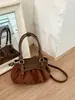 Nuevo bolso de moda de nicho con pliegues en la axila para mujer, bolso de hombro vintage de alta gama para el día a día, bolso de mano popular