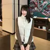 Chaleco chic de retazos a cuadros estilo coreano con cuello alto, una chaqueta acolchada cálida y a prueba de viento para mujeres petite, perfecta para el invierno
