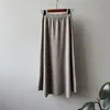 Falda midi de punto minimalista estilo coreano para mujer, nueva colección otoño/invierno 2026, de cintura alta, adelgazante, corte holgado, falda línea A suave y cómoda con dobladillo acampanado