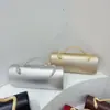 Nuevo bolso de noche de lujo ligero transfronterizo para mujer, bolso de mano cilíndrico de color liso con asa de serpiente para fiestas de cóctel y banquetes