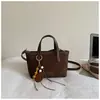 Bolso de Cubo de Mano de Alto Valor para Mujer Otoño 2026 Nuevo Bolso de Hombro Casual Elegante Sensación Relajada Bolso Cruzado Retro