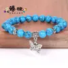 Venta al por mayor transfronteriza Amazon Joyería Pulseras con Colgante de Mariposa con Múltiples Opciones de Color, Pulseras Redondas de Perlas de Pino Blanco Natural Son Éxitos de Ventas