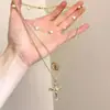 Collar de Cadena Cruzada con Borlas de Múltiples Capas Estilo Retro Francés para Mujer, Diseño de Nicho, Gargantilla de Cadena para Clavícula Moderna y Versátil