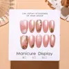 T826 Tarde Champagne Oval Corto Estilo Chino Nuevo Rosa Nude Suave Ojo de Gato Hielo Transparente Dorado Metálico Floral Pintado a Mano Uñas Portátiles