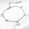 Nuevos productos europeos y americanos para el comercio transfronterizo: pulseras de acero inoxidable brillantes con forma de corazón, incrustadas con conchas y de diseño moderno y sencillo. Venta al por mayor.