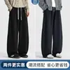 Pantalones deportivos para hombre de otoño con dobladillo curvo y caída, pantalones plisados de retazos estilo americano, pantalones casuales rectos para hombre de primavera y otoño
