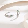 Pendientes de acero de titanio con circonita de ojos verdes y forma de serpiente de moda transfronteriza, diseño de nicho femenino, pendientes de moda fría de lujo ligeros de alta gama