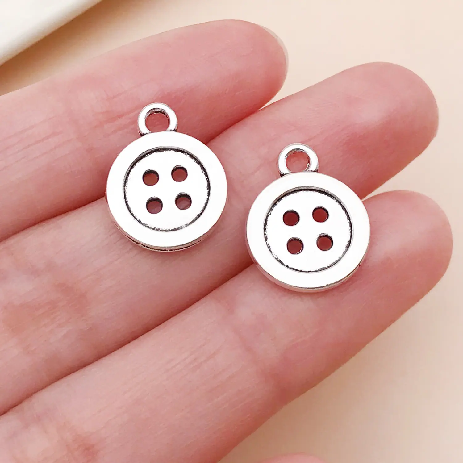 24717-X-古银锌合金缝纫工具纽扣16x12x1.5mm