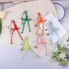 Nudo de Corazón Creativo Nuevo Estilo Miu Lanyard Versátil Llavero Colgante para Bolsas y Fundas de Teléfono