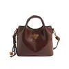 Bolso de mano con textura de alta calidad para mujer, nuevo bolso bandolera retro de gran capacidad para desplazamientos, otoño e invierno 2024.