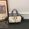 Bolsa pequena quadrada leve xadrez color block casual 2026 nova versátil multi-bolsos prática de ombro crossbody