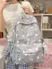 Nueva mochila de gran capacidad de estilo japonés para mujer, linda y fresca, mochila informal artística con estrellas para chicas y estudiantes.