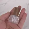Venta al por mayor de fábrica 10 ml Decantador de perfume Mini tapa de madera maciza Portátil para viajes Botella de perfume Atomizador de niebla fina Botella de vidrio vacía
