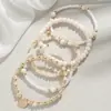 Al por mayor de Joyería de Mano Europea y Americana Transfronteriza Colgante de Disco Cuentas de Arroz Grandes Elástico Moda Temperamento Conjunto de Múltiples Piezas Pulsera para Mujer
