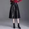 Elegante falda de cuero versátil de color sólido, nuevo modelo otoño/invierno 2026, falda de línea A de cintura alta de cuero PU que cubre la cadera