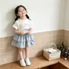 Conjunto de Duas Peças Verão Novo Desenho Animado T-shirt Versátil Xadrez Doce Bolo Saia Meia Fofa Bebê