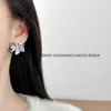 Pendientes de botón plisados con forma de lazo y circonita súper suaves y dulces para mujer, pendientes de nicho únicos y hermosos, nuevo modelo 2026 con un toque de alta gama