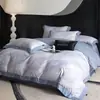 Nuevo juego de ropa de cama de cuatro piezas de algodón de fibra larga cepillado, con 60 hilos, que ofrece una sensación lujosa y de alta gama, disponible en estilos de sábana plana, sábana ajustable y colcha de algodón puro