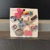 Zapatos Perforados Estilo Barbie con Decoraciones de Zapatos de Jardín Arcoíris de Alta Gama, Hebilla Integrada de Concha y Estrella de Mar, Accesorios de Plástico para Ventas Transfronterizas