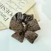 Lujo Ligero Retro Nicho PU Estampado de Leopardo Empalme Garra Triangular Goma para el Cabello Moño Pasador Cuerda para el Cabello Accesorio para el Cabello