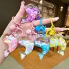 Nuevo llavero de muñeca de delfín con arena movediza relleno de aceite, colgante para mochila, decoración para bolso de pareja, regalo pequeño para venta al por mayor
