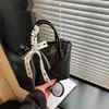 Bolsa de mano de moda casual y moderna de verano 2026 transfronteriza, bolso tipo cubo para mujer, bolso de hombro cruzado
