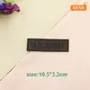 Ropa rasgada pegatinas de tela autoadhesivas parche bordado con logo negro aplique chaqueta de plumas sello bordado planchado margen de reparación