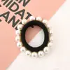 Versión coreana de perlas para uñas sin costuras 16 perlas anillo para el pelo Red simple Joker Anillo de toalla de perla cuerda de color para la cabeza al por mayor
