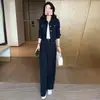 Moderna chaqueta corta de trabajo de otoño para mujer y pantalones casuales de pierna ancha, conjunto de dos piezas adelgazante y rejuvenecedor