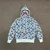 Sudadera con Capucha Doble y Estampado de Camuflaje con Letras Bordadas 'Shark', Chaqueta con Capucha Cruzada al por Mayor en Stock, Manga Larga Casual y Versátil