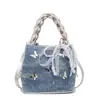 Bolsa Pequena com Textura para o Verão para Mulheres 2025 Nova Bolsa de Ombro Transversal Borboleta Corrente Prateada Bolsa Estilo Balde da Moda