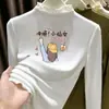 Ropa interior térmica para niñas Otoño/Invierno 2026 Nuevo estilo Terciopelo alemán Top de manga larga con volantes y cuello alto para niños de mediana y mayor edad