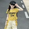 Conjunto de Verano para Niñas 2026 Nuevo Estilo Niños Medianos y Grandes Verano Elegante Celebridad de Internet Top de Manga Corta Pantalones Casuales Conjunto de Dos Piezas Moderno