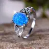 Deseo transfronterizo AliExpress moda viajero Palladium Blanco K forma de huevo borde de ópalo azul anillo cruzado suministro de fábrica al por mayor