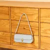 Bolso de axila de nicho de alta gama estilo coreano, bolso de mano versátil chic vintage, bolso baguette simple personalizado para el día a día